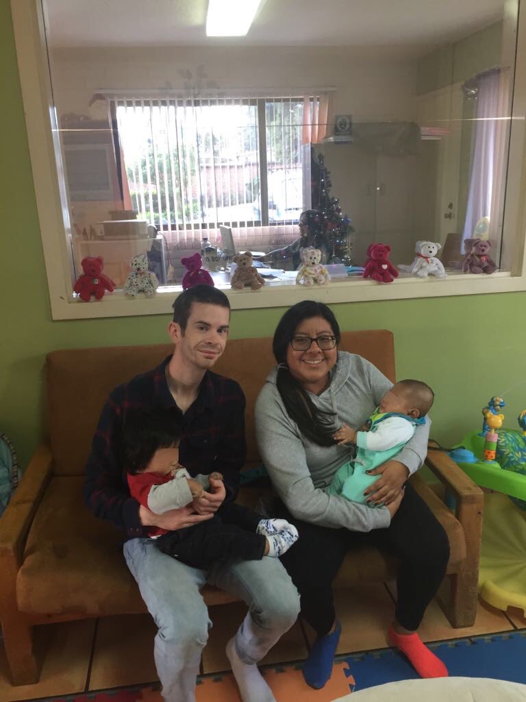 FHCEcuador's tweet photo. It’s such a joy to have FHC graduates visit us! Sarita de la Torre with her boyfriend, Jeffrey, spending time with babies in Casa Vaughn. https://t.co/vaWhiIyazD