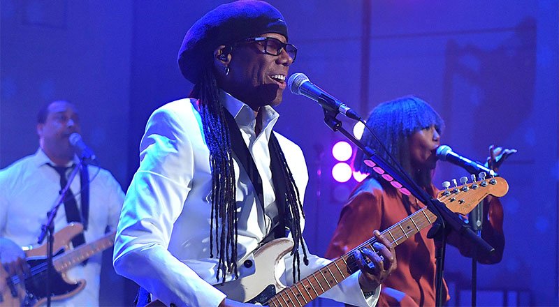 BBC's tweet photo. Tonight, @NileRodgers and @CHICorg are live from London to welcome in the new year. Watch on @BBCOne from 11:20pm. #NewYearsEve 🎉 🎶 🥂 🎆 https://t.co/fMQTEVIMkr https://t.co/ppIfHTttVo