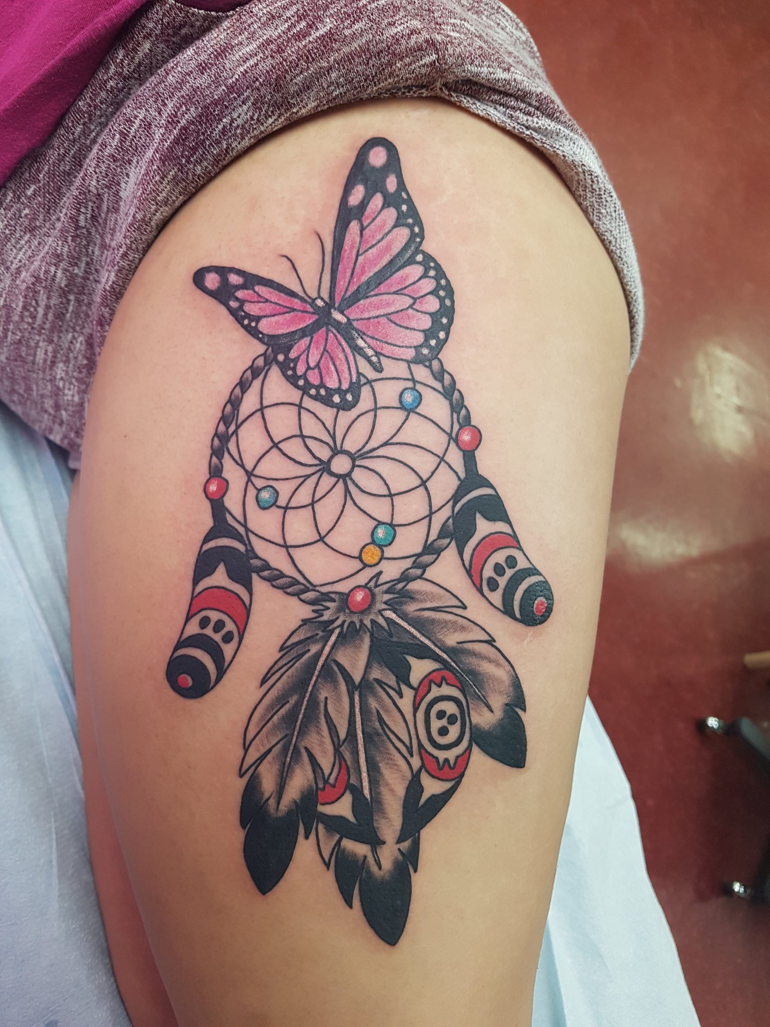 Black Butterfly And Simple Dreamcatcher Tattoo On Upper Back by Xpose  Tattoos Jaipur