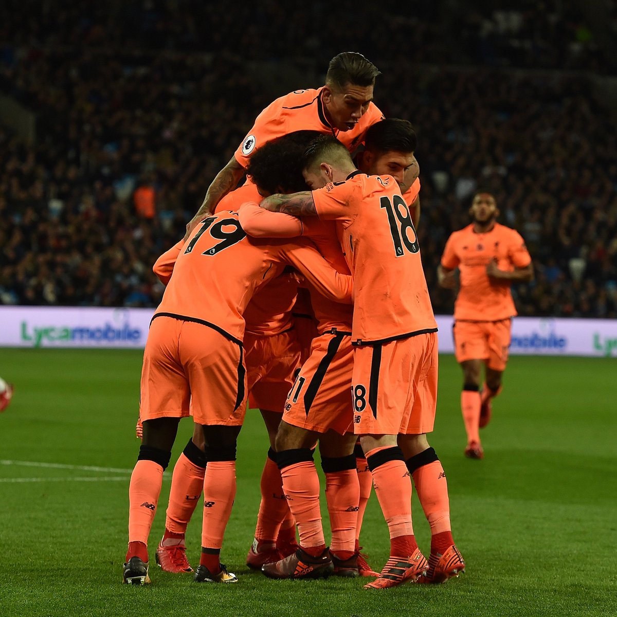 LFC's tweet photo. Wishing you all a very happy New Year from everyone here at Liverpool FC 🎉 https://t.co/G7A6lJdJPl