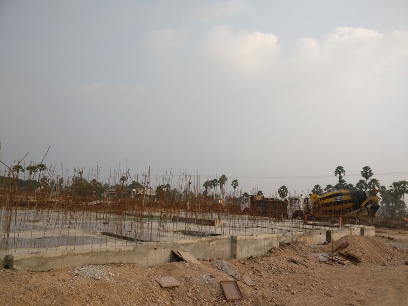 Multiple teams work on different blocks concurrently. You would see almost all stages of construction in different blocks any day. Here is one for which the foundation just got complete. Walls will be raised from the reinforcing bars seen in the picture.
