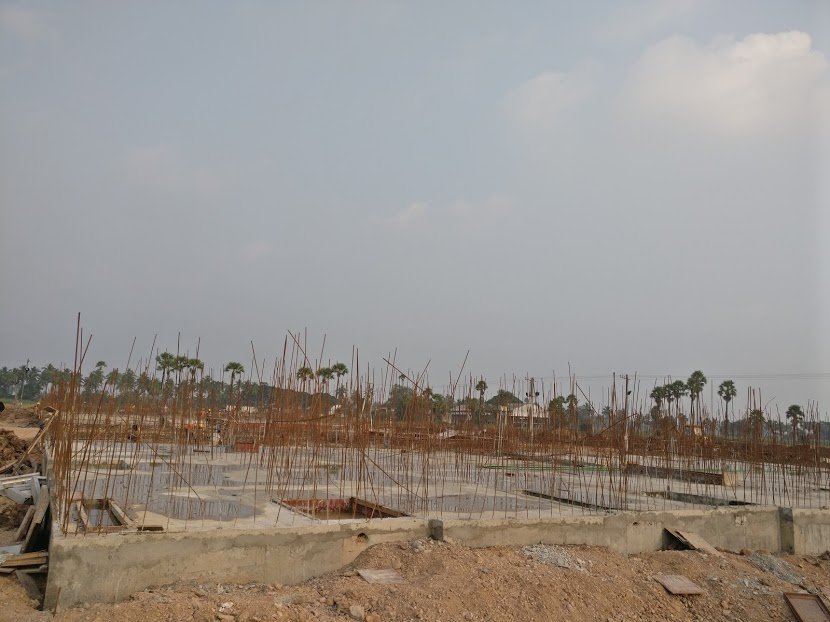 Multiple teams work on different blocks concurrently. You would see almost all stages of construction in different blocks any day. Here is one for which the foundation just got complete. Walls will be raised from the reinforcing bars seen in the picture.