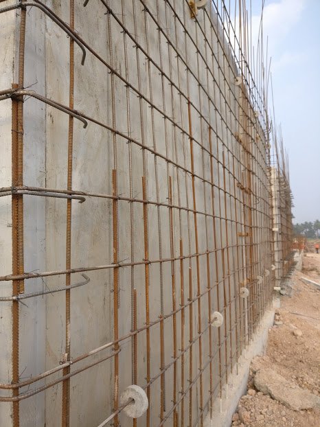 Here is the construction of the first floor. Steel frames which are as per the house design will be fixed internally and externally with reinforcing bars between them. Entire cavity will be filled with concrete after the fixture is complete. Steel frames are imported stuff.