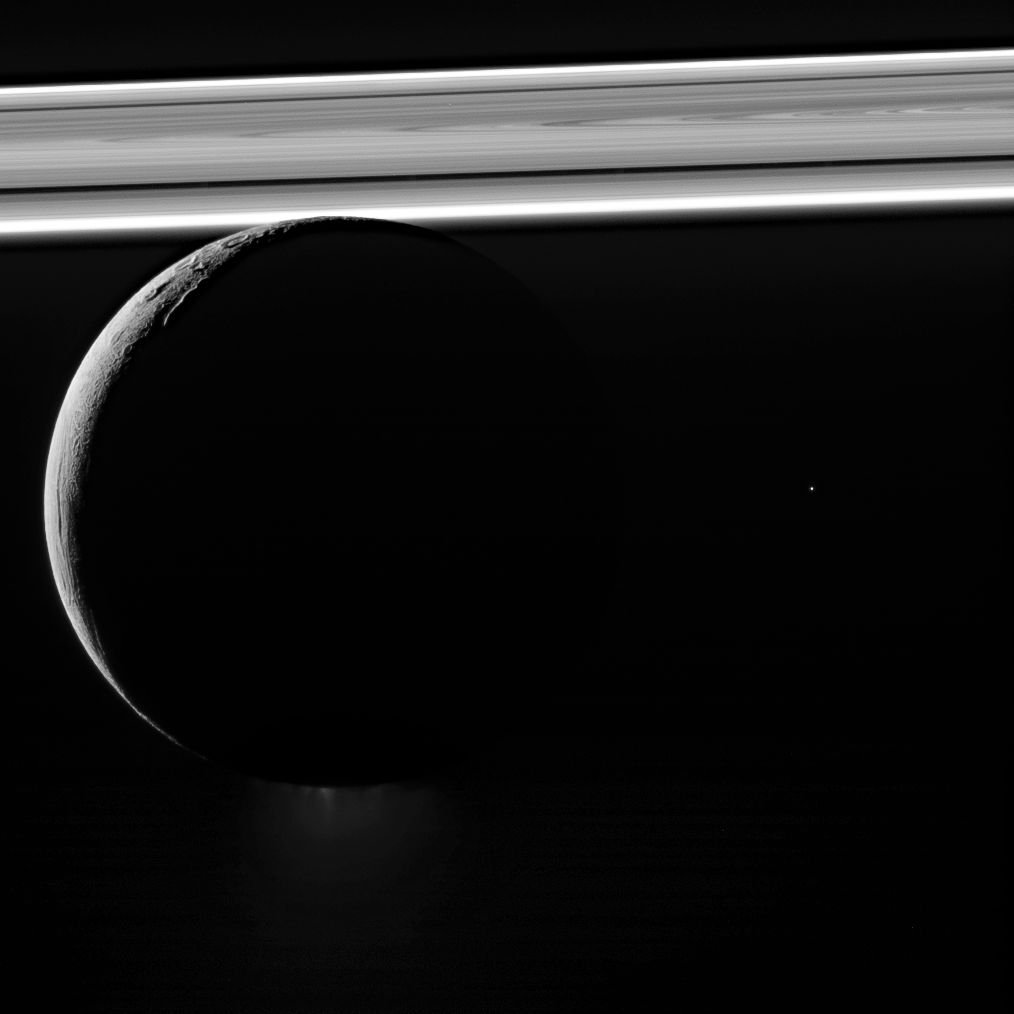Saturn's moon Enceladus drifts before the rings, which glow brightly in the sunlight buff.ly/2CwMXPw