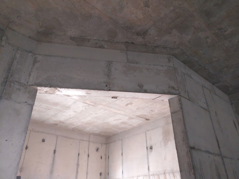 All the window spaces are part of the steel structure which is predesigned. Electrical wiring is done through the cavity before the concrete is filled. Literally, there is no requirement of drilling and breaking post raising the structure.