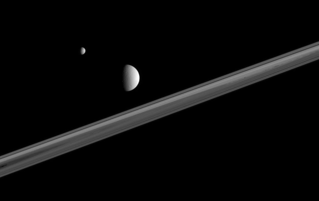 Two of Saturn's icy companions hover here, above the ringplane buff.ly/2lwXrq7