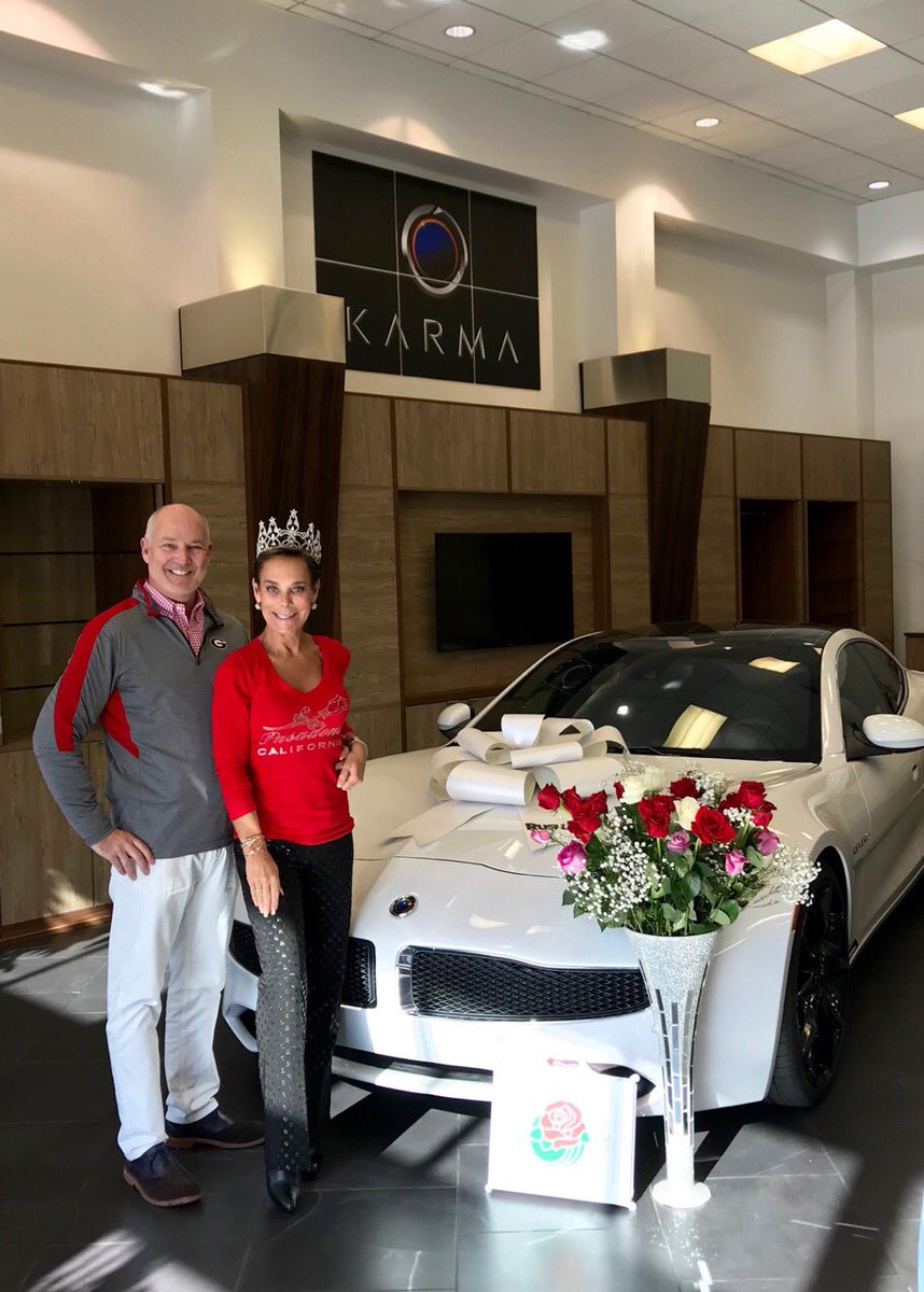 JimTaylorDrives's tweet photo. Celebrating the new year with Liz Rusnak - wearing her Rose Parade tiara  - in the @RusnakAuto /Karma of Pasadena showroom located on the famous Colorado Ave where Parade of Roses travels. Happy new year! #KarmaAuto #RoseParade https://t.co/1bWvCeQG73