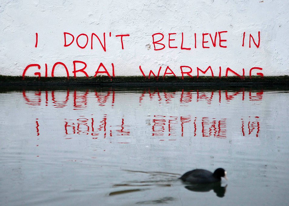 jennyecke's tweet photo. Photo Credit:  Luke McGregor/Reuters; Graffiti Attributed to Banksy https://t.co/7aj99DVJrJ