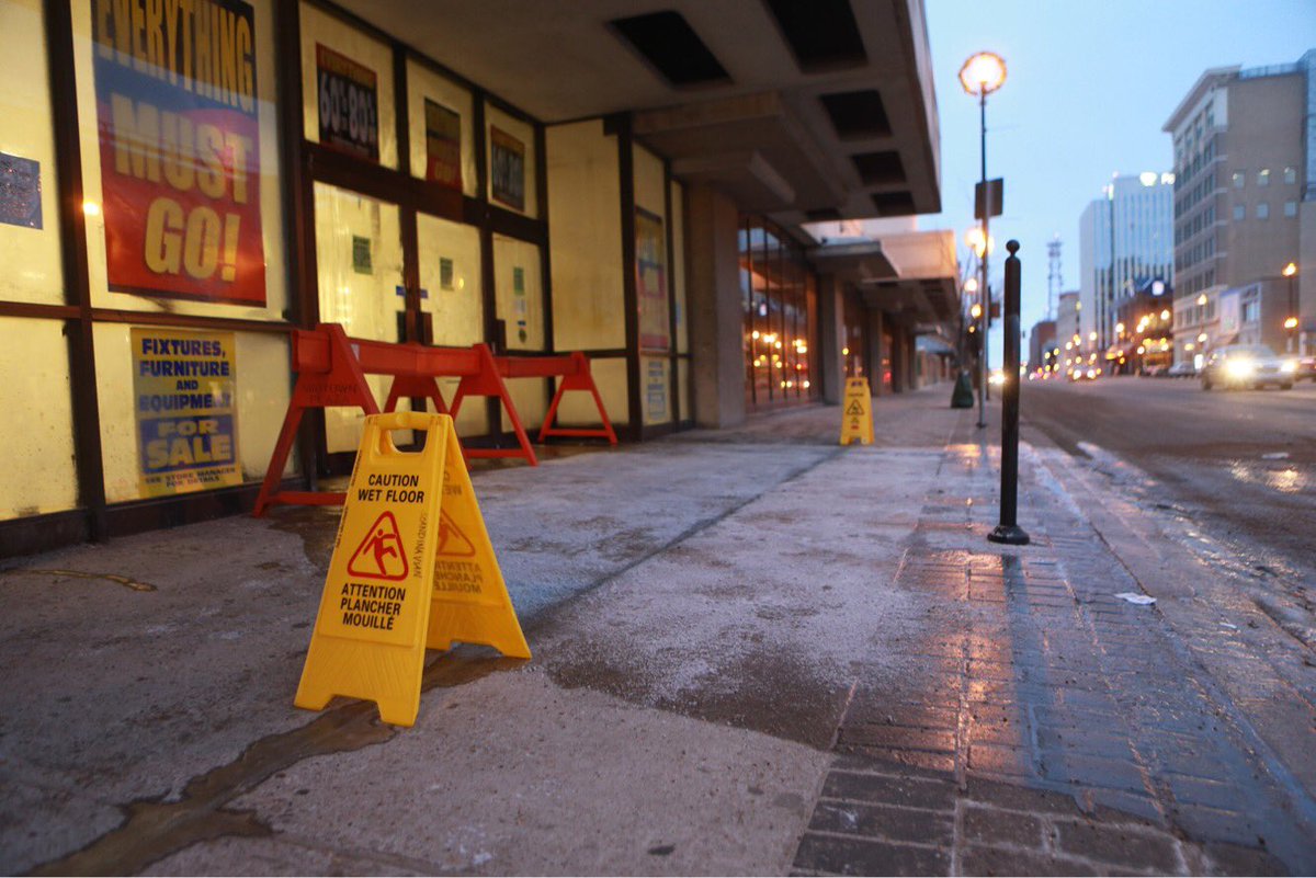 bergmichelle's tweet photo. Water flooding from inside Sears is creating a slippery sidewalk on 1st Avenue in Saskatoon on January 2, 2018. #yxe #sears https://t.co/r0nJ7sRAxG