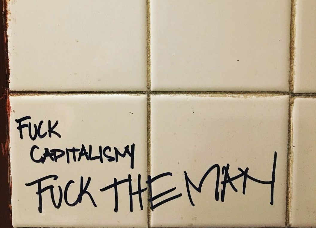 doNYC's tweet photo. After the final last call, we remember #GrassrootsTavern with the writing on the bathroom walls. #RIP - https://t.co/U2AbqsrPrp https://t.co/vHrTu4X9VW