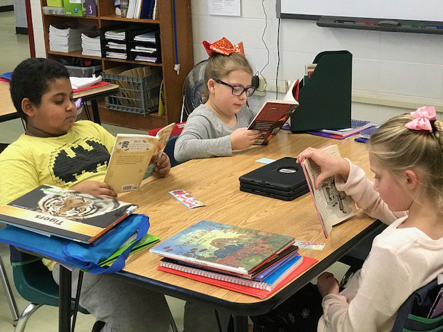 SchDistofMilton's tweet photo. Ms. Hill's 3rd grade students @milton_east_way are beginning 2018 with good reading habits and a good book. #SDMReads #MiltonPride https://t.co/hpPKjlVia3
