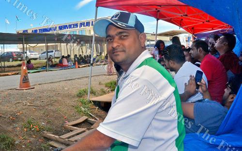 fijitimes's tweet photo. Prithikesh Nand is starting to feel the pinch of being out of work for 18 days, but he is not willing to give in and is willing to fight on. #FijiNews #ATSDispute #ATSImpasse #Day19 https://t.co/19lnMQCpml https://t.co/PM6VqJLyXD