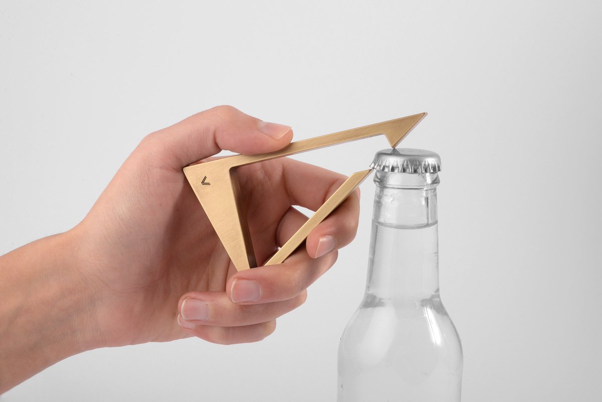 adesignw's tweet photo. Designed as a tool and piece of art, the Triangle bottle opener from @vauproducts is an everyday functional #object made from solid metal.
#productdesign #art #sculpture #bottleopener #opener #solidmetal #Metal #brass #Finish #handpolished #german #design #council #AwardWinning https://t.co/6vrVyaENl6