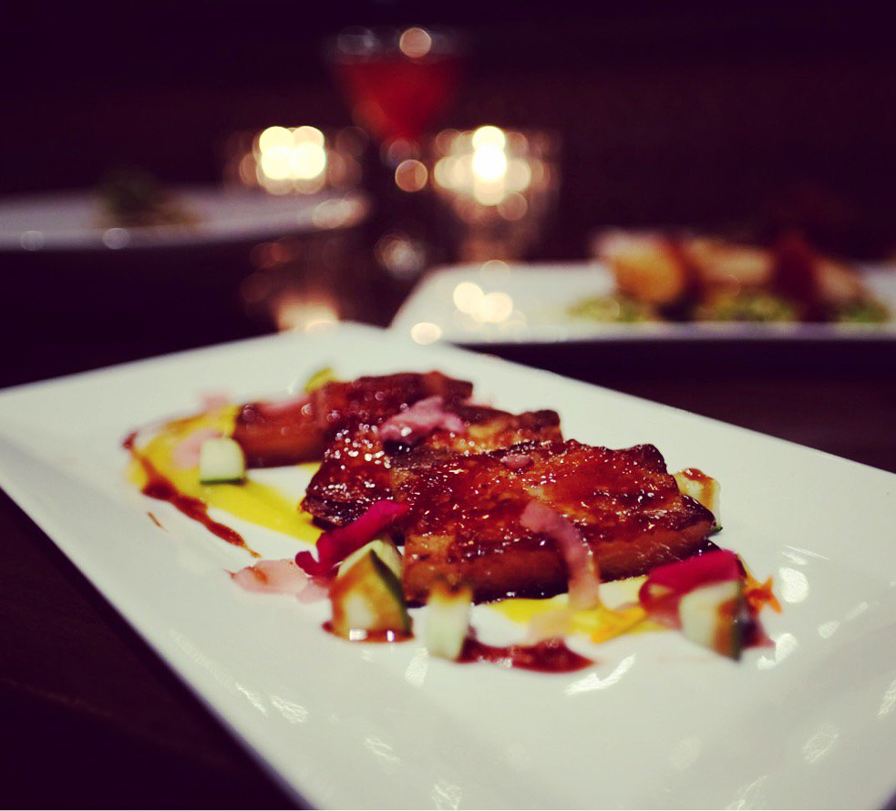 Table21Vic's tweet photo. Come in for our delicious Confit Pork Belly tonight. Char Siu pork belly, butternut squash purée, picked onion, cucumber and micro greens. #table21vic #tapas #yyjrestaurant https://t.co/ORY8yB4OYm