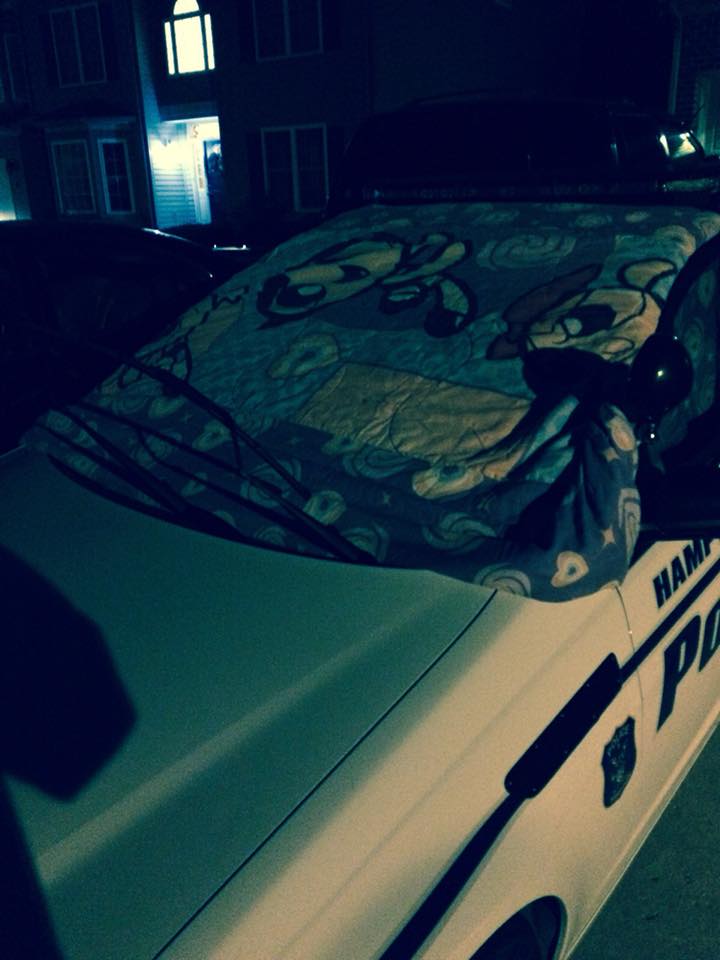 HamptonVAPolice's tweet photo. This is how our officers are preparing to go to work all night in the snow; making sure their windshields aren’t covered in ice. (Yes those are the Powerpuff girls) #winterstorm #bombcyclone https://t.co/8qI10c09Av