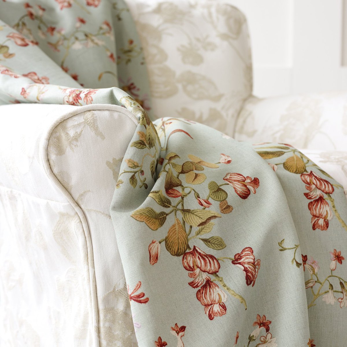 Bring classical contemporary style home with this pairing of classic rich reds and heritage hues (BOWES LINEN 02) and chabby-chic "etched" jaquard (PURBECK 02) #classicinteriors #floralfabrics #upholstery #colourmyhome