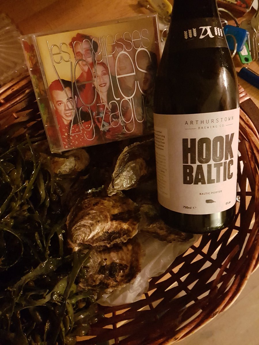 3  friends for dinner tonight , hook oysters, stout., a little French in the background.