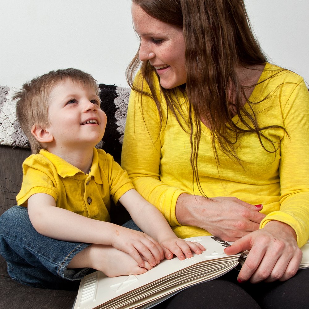 Today is #WorldBrailleDay! #Braille opens so many doors, promotes literacy and communication, and helps brings people together. [Photo: A mother and child read a braille book together]