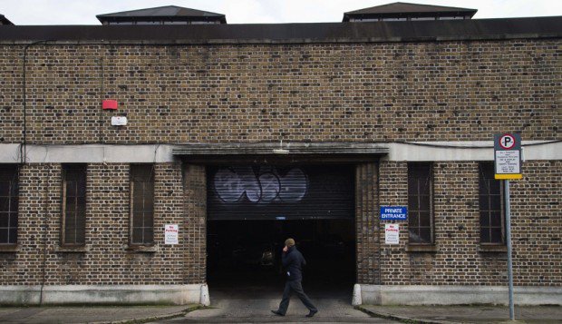 totallydublin's tweet photo. #TBT:  #NiceGaff: Postal Garage Sandwith St "Is that you doin’ that graffiti?" came a call from a woman in a doorway across the street as I was taking photos of the garage façade. https://t.co/IoDwXTeSsq https://t.co/D7fwfuRFf4