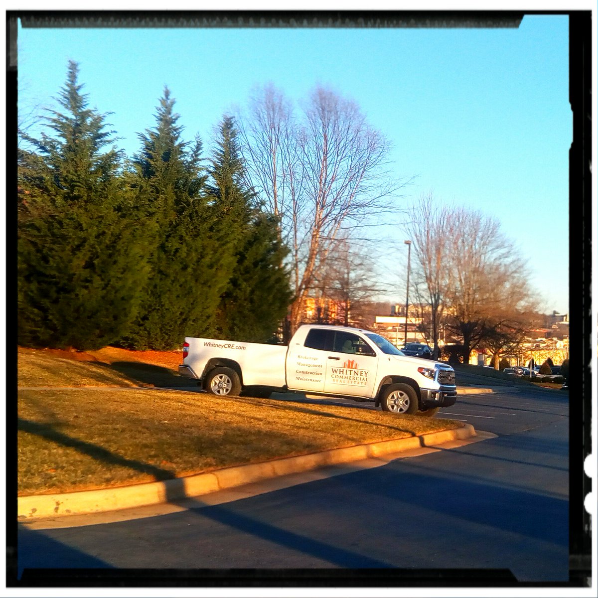 WhitneyCRE's tweet photo. Our work truck gleaming in the winter sun with a logo you can't miss. #whitneycommercial #wcre #cre #brokerage #propmgmt #construction #avlbiz #wnc https://t.co/jZ2B5a8J3k