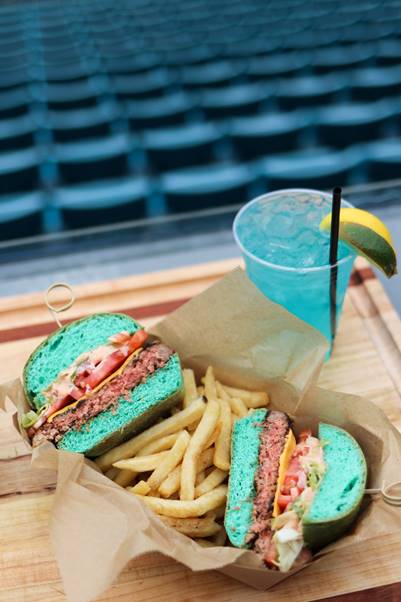 SBNation's tweet photo. These burgers with blue buns that the Jaguars are selling for the Wild Card game look _________. https://t.co/OXyBOhGc7s