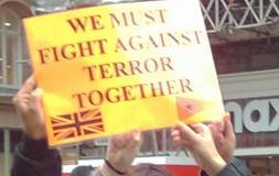 LeftCommunist's tweet photo. When nationalism isn't enough, so you go full scale imperialist. Placard being held up by members of Merseyside Anarchist Federation @AnarchistFed at a solidarity with Rojavo demo/vigil in Liverpool a few years ago #nationalistscum #nowarbutclasswar https://t.co/CNXnfY3M1g