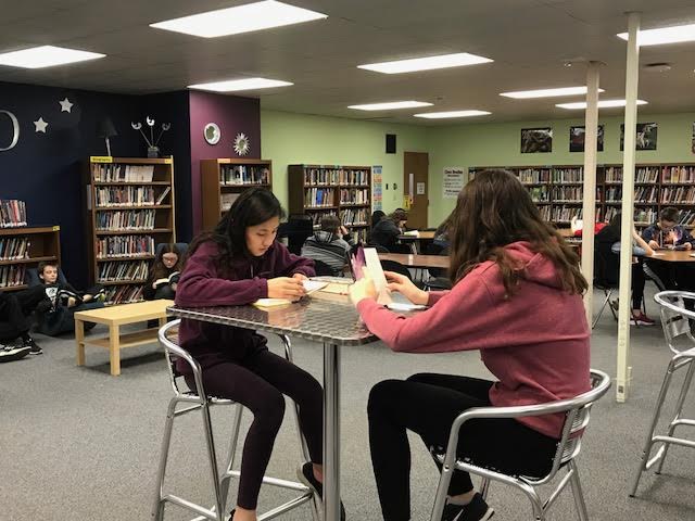 SchDistofMilton's tweet photo. Hey @MattBieds+@TaraCzerwinski, your @MMS_RedHawks in @MrsMiles200 class are enjoying a #FunFriday reading in the library this morning! #SDMReads #MiltonPride https://t.co/zZOdJxUr1X