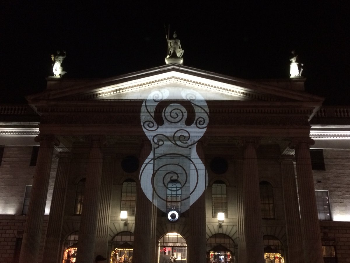 HerstoryIreland's tweet image. #SheilaNaGig lighting up the #GPO in Dublin City. Bazooka light show by Ge0Pop #IlluminateHerstory #NollaignamBan