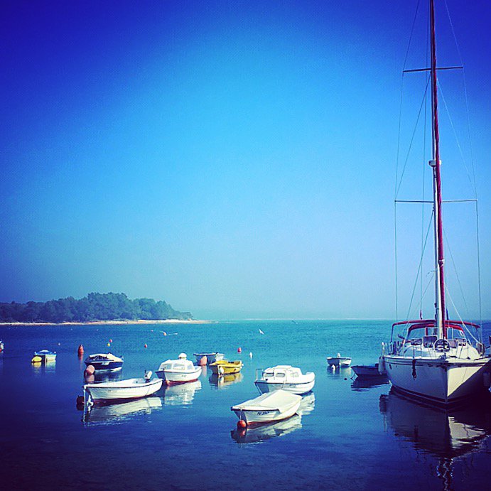 IstriaLife's tweet photo. Winter in #Istria. Boats bobbing about in the tiny bay of #Peroj. How beautiful? https://t.co/nQz2BPu7pz