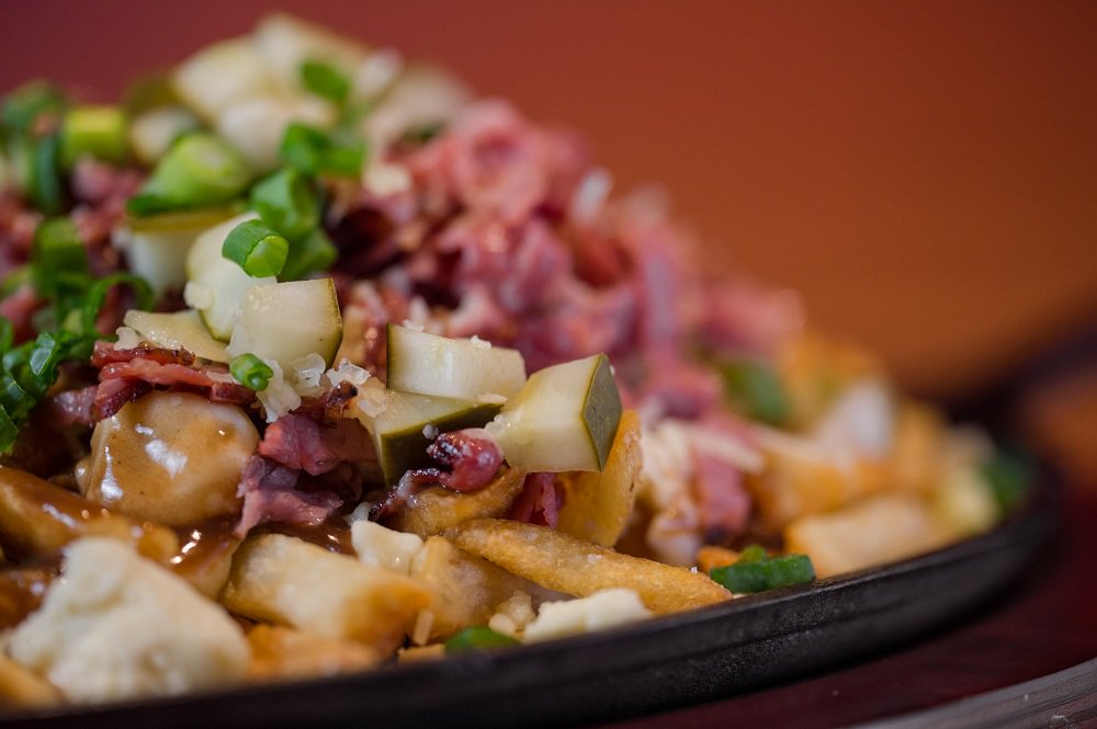 MatchPubLangley's tweet photo. We're taking poutine to a whole new level with the CARNEGIE. Picture yourself enjoying Fresh cut fries, Montreal smoked meat, dill pickles, cheese curds, gruyère cheese, topped off with our signature Guinness gravy. Now that's a poutine to make your Mom proud #MatchPub https://t.co/B3MRR9EcxT