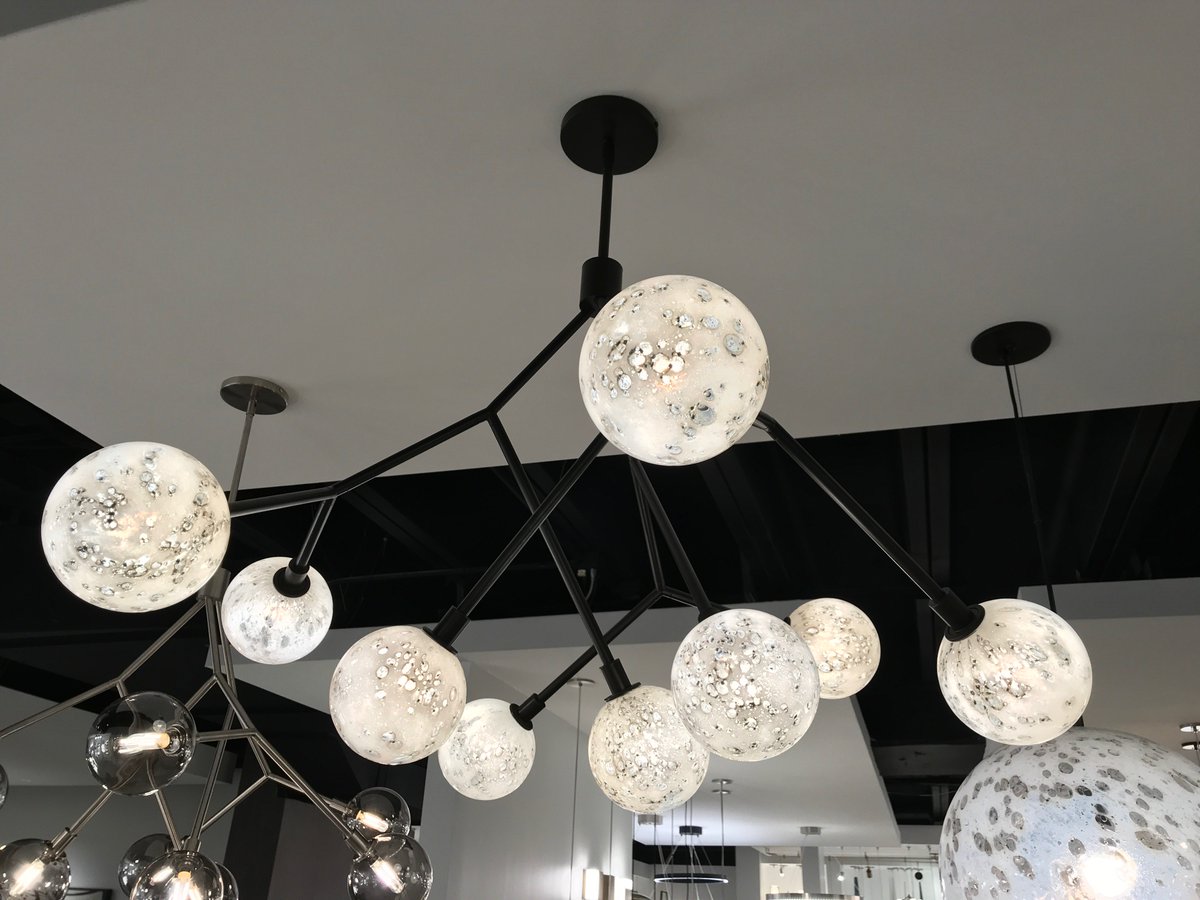 Otherworldly beauty shines in the new Malena 9 #chandelier. Pearl glass globes adorn the antique bronze arms, emitting a warm glow. Debuting at #Lightovation, TM-4075 --> bit.ly/Malena9