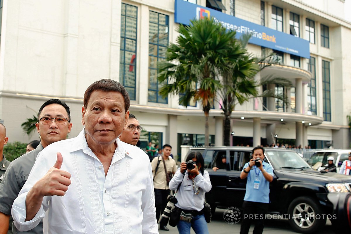 #PresidentDuterte does a thumbs up gesture as he poses for a photo outside the Overseas Filipino Bank (OFBank) at the Postbank Center, Liwasang Bonifacio in Manila on Thursday. OFB aims to cater to the banking needs of Overseas Filipino Workers and their families. |PPD