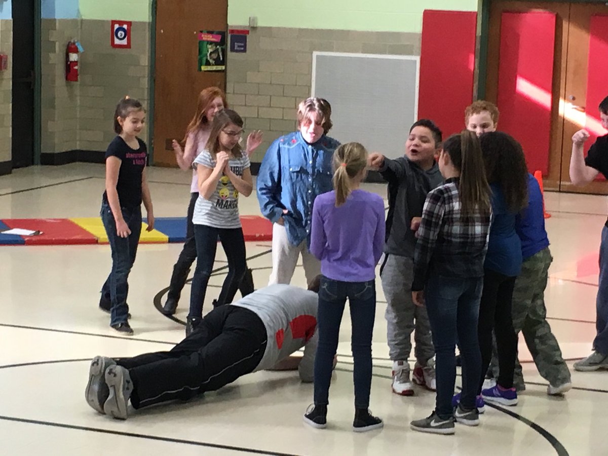 The physical education teacher loses in a rock paper scissors competition and has to do push-ups