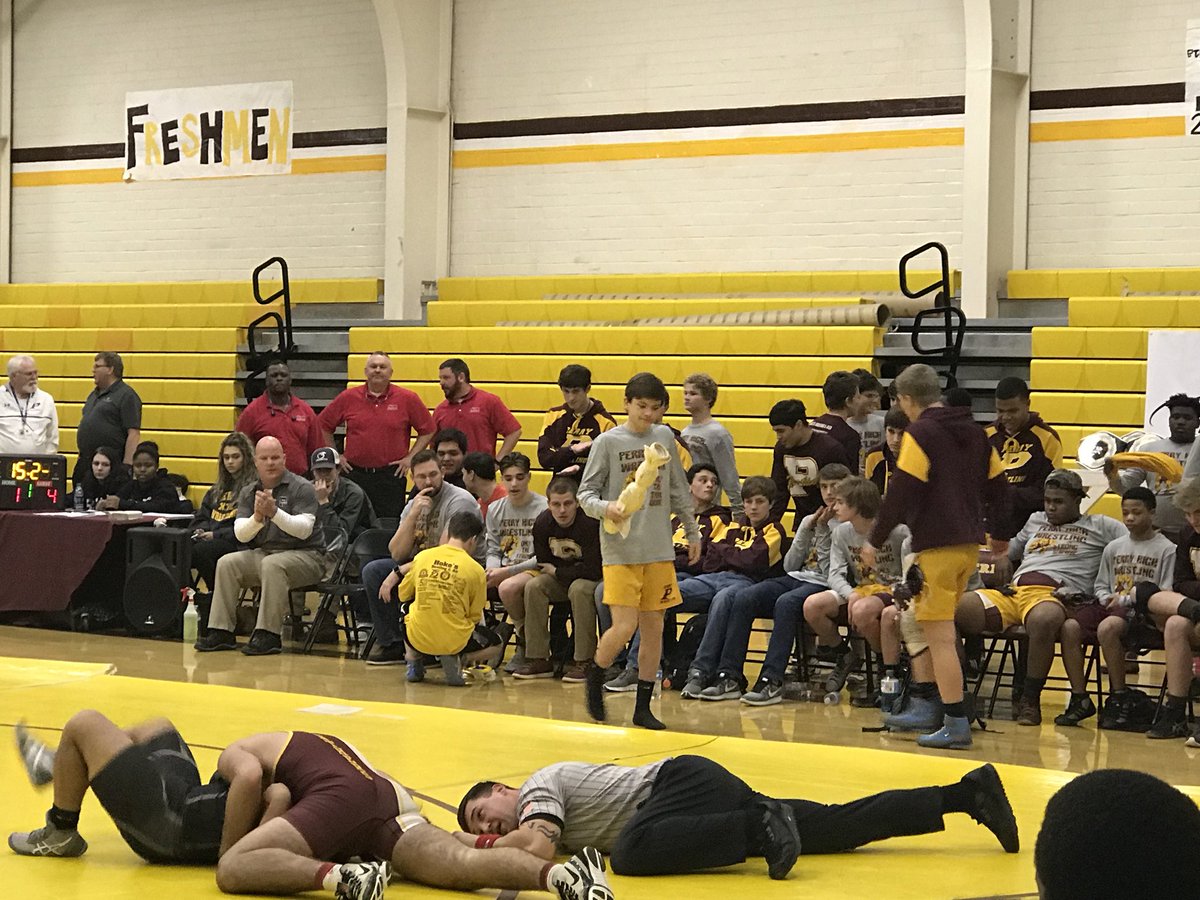 <a href="/perry_wrestle/">PHS Wrestling</a> and Coach <a href="/Randy_Moss1/">Randy Moss</a> (far left) is into this match with <a href="/HOCO_Wrestling/">Houston County High School Wrestling</a>