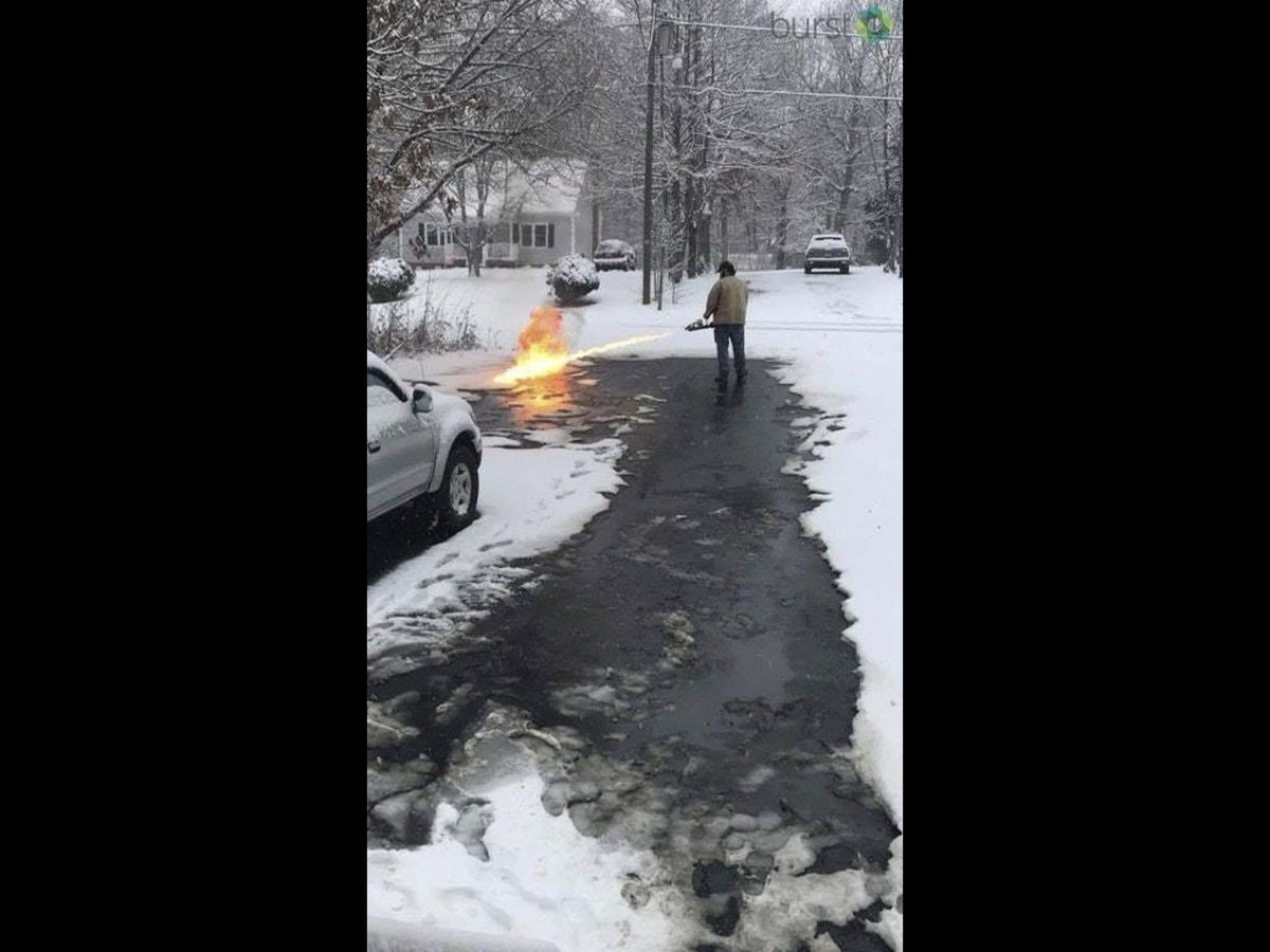 DevonESawa's tweet image. Meanwhile in Canada: Man uses a flamethrower to remove snow for his neighbors.