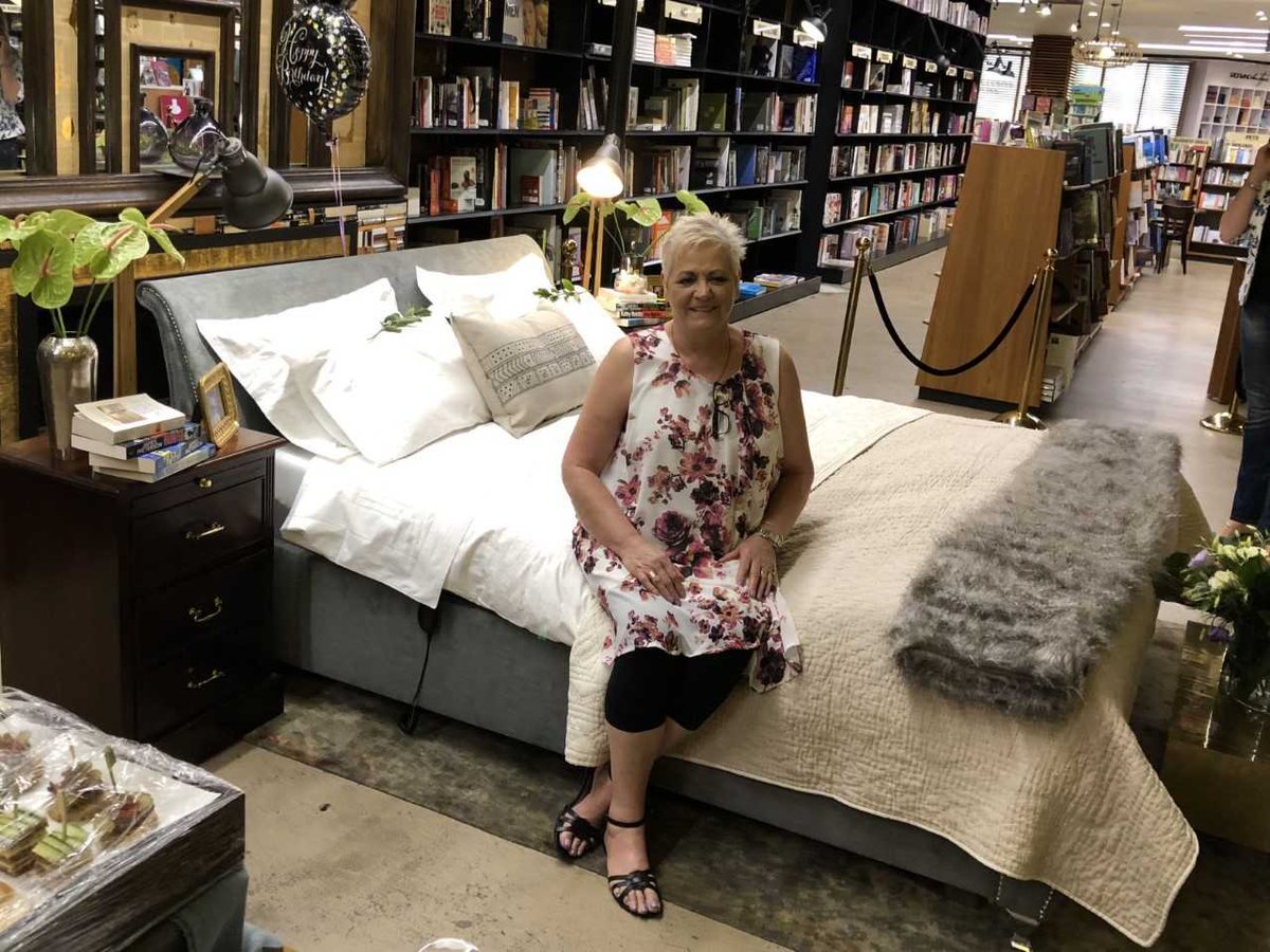 HelloMagSA's tweet photo. What an awesome story! @ExclusiveBooks @HPCHydePark last night fulfilled the life-long dream of Carina Greyling to celebrate her 60th birthday. Her birthday wish? To be “locked inside an Exclusive Books for the night” And she was - with a snazzy bed from #Vencasa too! https://t.co/B1KG8me3qC