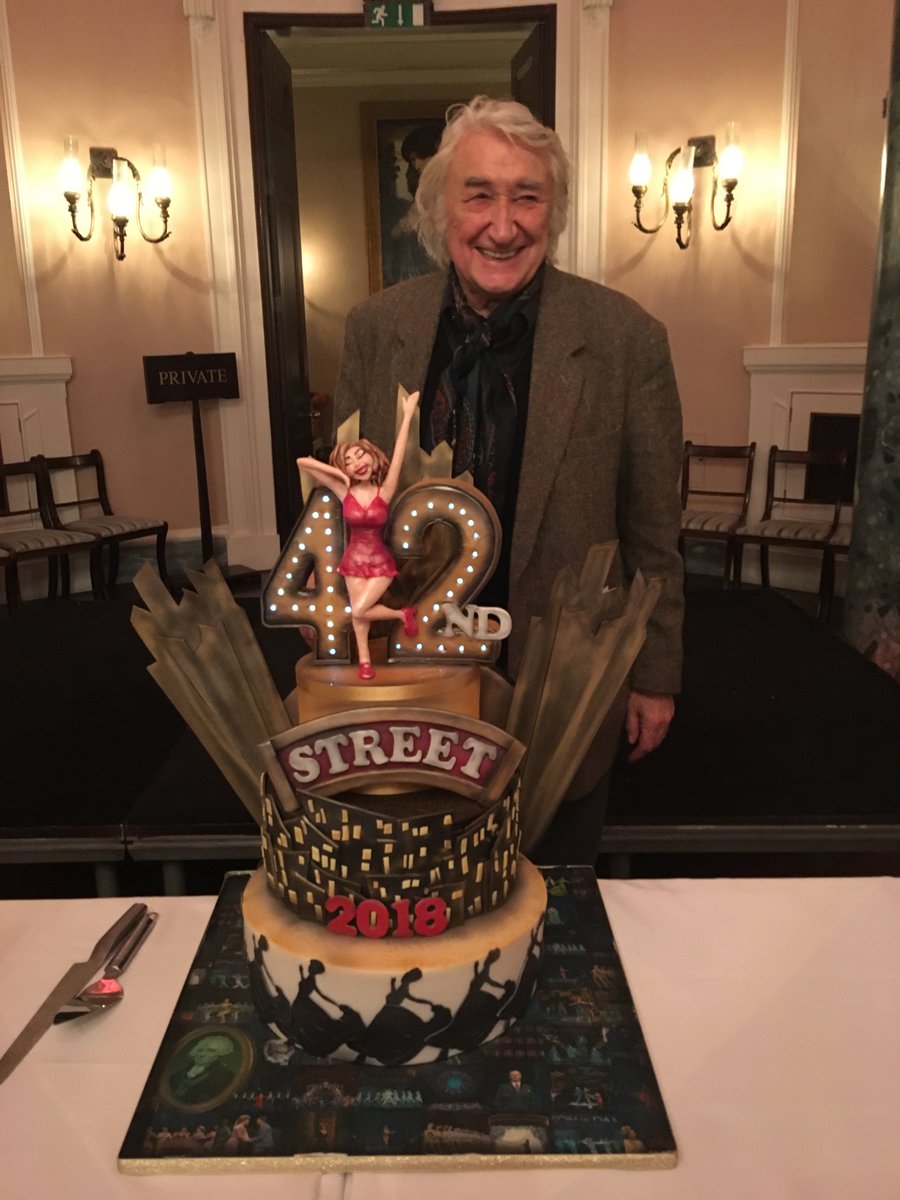 PaperLionLtd's tweet photo. Fabulous 42nd Street cake on 12th Night, to commemorate Garrick's 200 yr-old charity for Theatre Royal actors, with Bruce Montague, star of 42nd Street @42ndStreetLDN at @TheatreRoyalDL  - Don't eat it all at once Bruce! https://t.co/by5nK5Mitz
