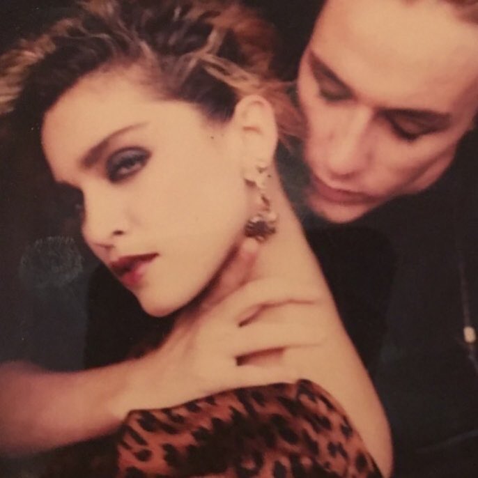 Madonna's tweet photo. Throwing Back So Hard and living for this wonderful moment on a rooftop in NY where I did my first photo shoot with #stevenmeisel ♥️💃🏿♥️💃🏿♥️💃🏿♥️💃🏿 #brilliant #unique #genius #photography #neverforget 🖤 https://t.co/c5rz5tJ9lJ