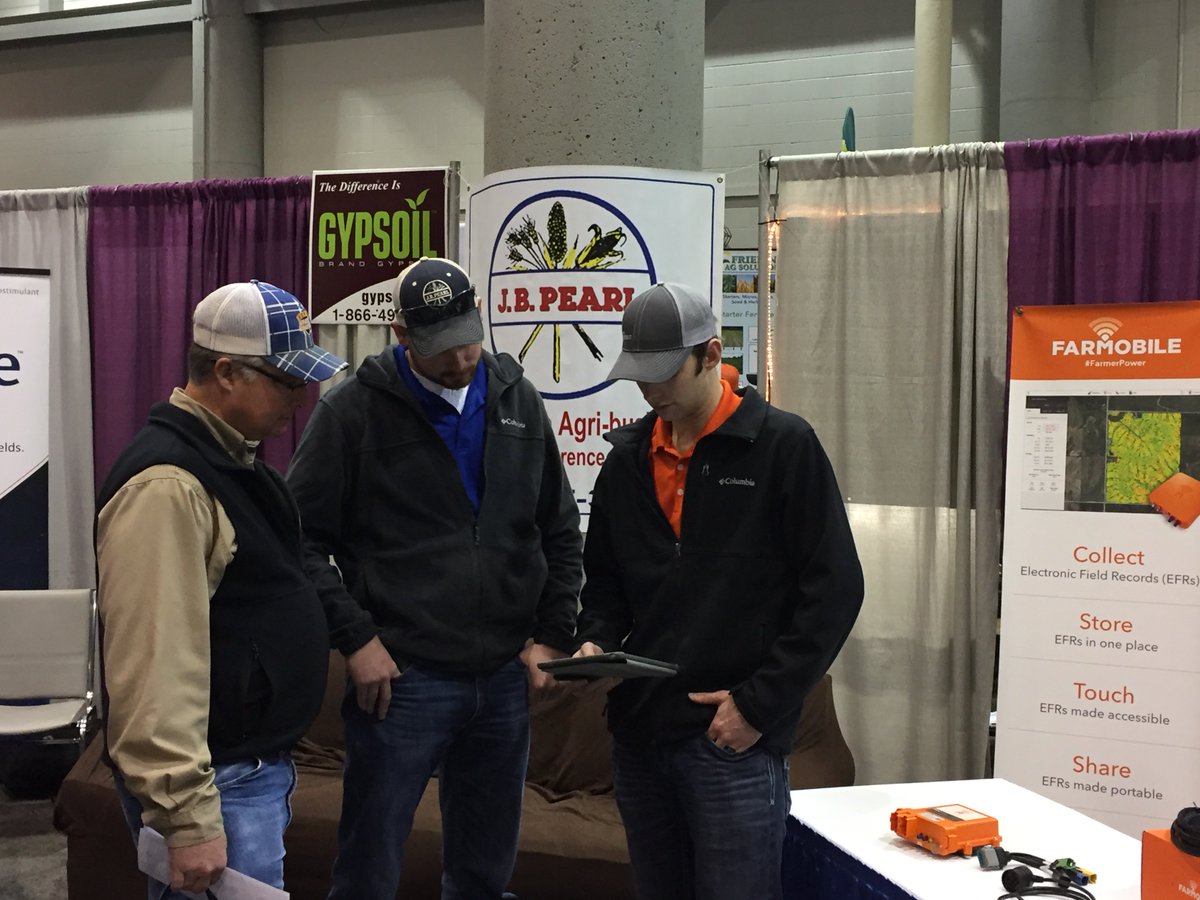 FarmobileLLC's tweet photo. Morning meet up at #TopekaFarmShow. JD Urish (center), high yield specialist at JB Pearl, and Brett Lenz (right), #Farmobile account manager, demonstrates real-time #data collection with a #farmer customer. https://t.co/aPeQcCvPZv