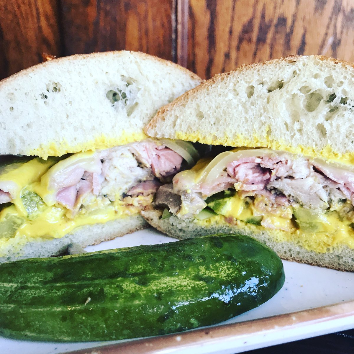 Cubano, mojo marinated pork, ham, Swiss, pickles, mustard on a cumin roll.