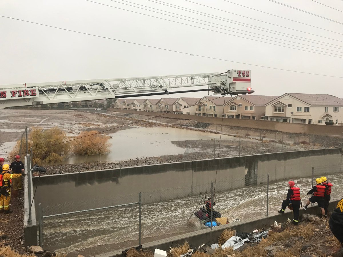 HendFireDept's tweet photo. #HendersonFire rescued a man from a flooded wash near Eastern and St. Rose this morning. There were no injuries. #Firefighters are asking everyone to stay out of washes and flood control channels and to not drive or walk through flooded areas. #SwiftwaterRescue #FloodSafety https://t.co/RG8FYUahPV
