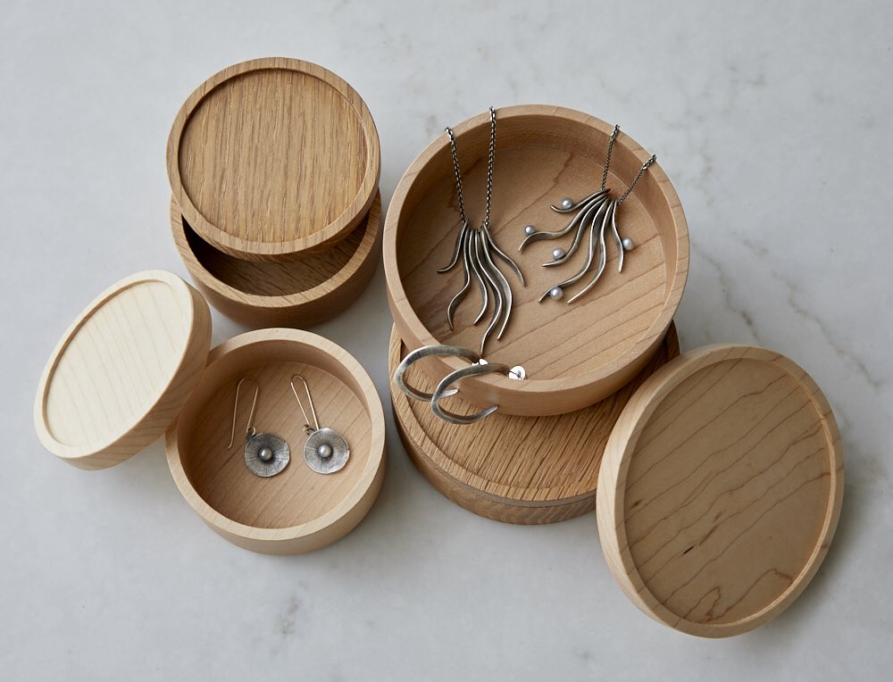 These stacking canisters by Heide Martin are shaped from high-quality American hardwoods, and are sized for a diverse set of uses. They are super beautiful and finished with a durable, food-safe oil. Sorry, but Maggie Bokor’s jewelry is not included! giftguidemaine.com/products/stack…