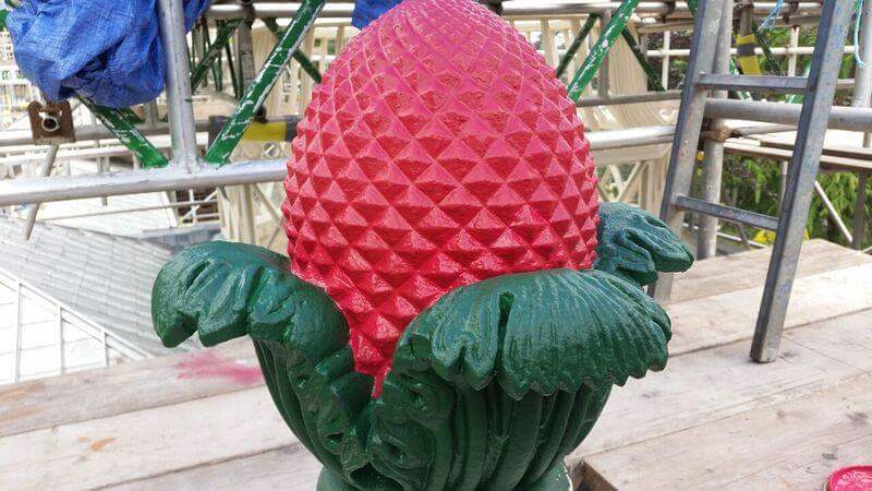 AltonTLC's tweet photo. We've invested over £1m in our Grade II Garden Conservatory  restoration project. Here is a colourful red pine cone from the top, surrounded by vivid green acanthus leaves. The colours are informed by the landscape architect and specialist architectural paint analysis. https://t.co/FsD9yosJ5c
