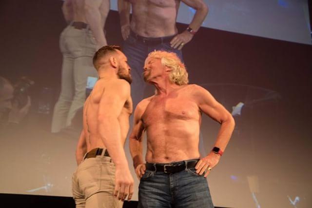 TheMacLife's tweet photo. Watch :: Conor McGregor and Richard Branson staredown in Dublin | https://t.co/2wz28cB2Ip https://t.co/G1zX12UESR