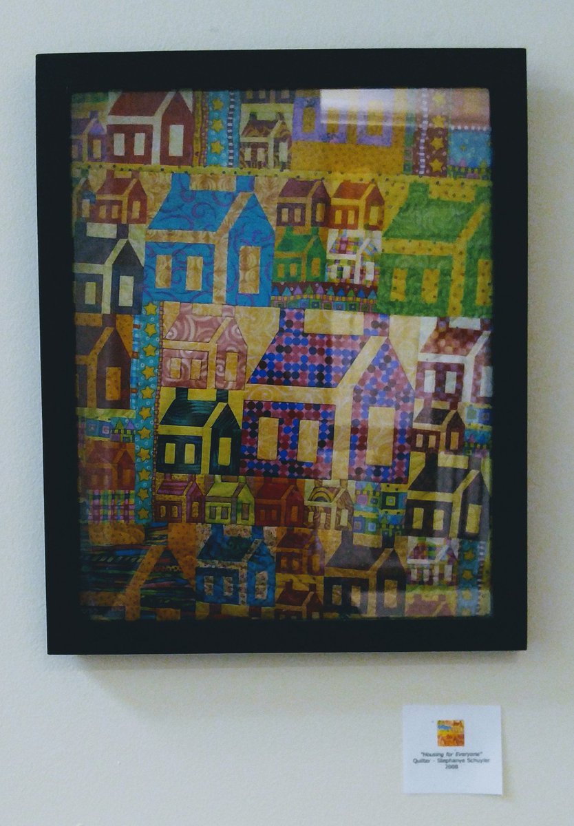 'Housing for Everyone' was quilted by a local quilter, Stephanie Schuyler, in 2008. Love art that is local and on-brand for the office! #housingforeveryone