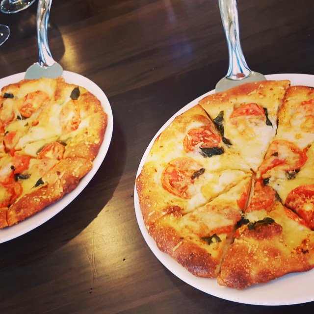 Table21Vic's tweet photo. Tag a friend you'd like to share our delicious 10” Thin Crust Specialty Pizza with. #table21vic #doubletreevic #pizza #yyj https://t.co/R8JAkQrMbK