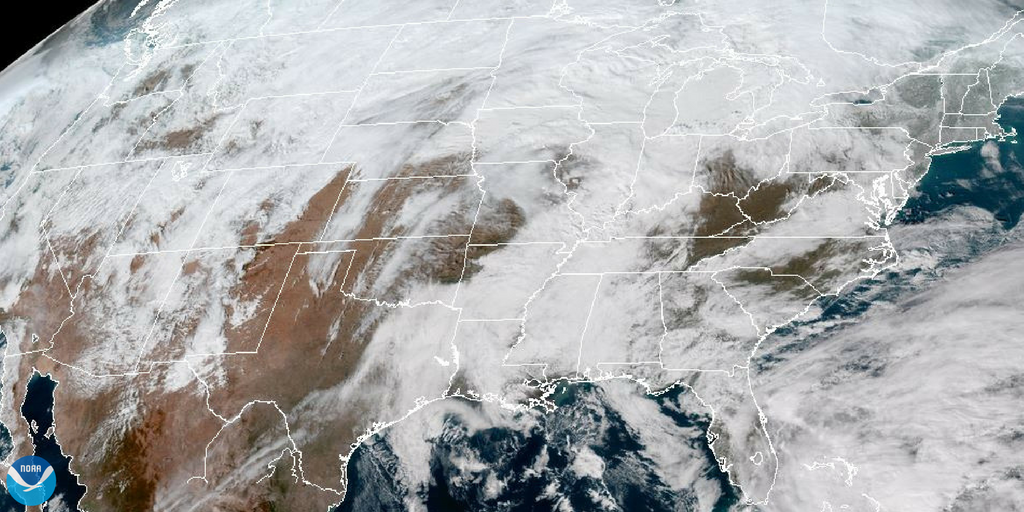 Satellite image of the United States, with clouds covering most of the land.