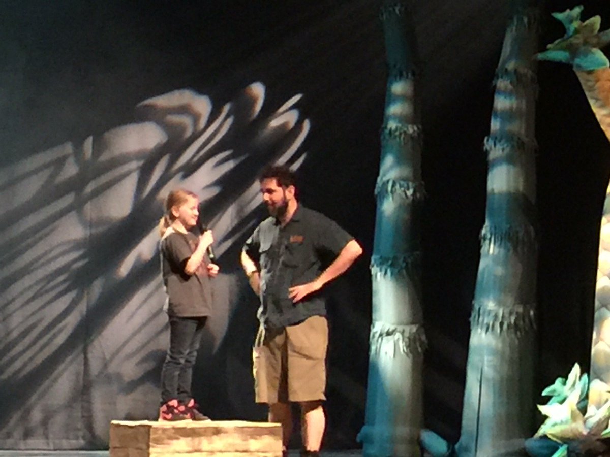 tkc2256's tweet photo. Tuesday our K-1 students attended a performance of Erth's Dinosaur Zoo Live! at the Lied Center. One of our students shared a dinosaur joke with everyone! Eva brought down the house! Everyone had a great time! https://t.co/CItRs02pZb