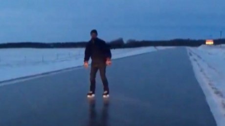 CBCManitoba's tweet photo. It's slippery enough to skate on some Manitoba highways — and this man did https://t.co/8Z9c4huqeh https://t.co/XaboJt9wRM