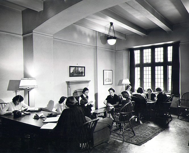 Trinity_College's tweet photo. #TBT to some “studious” St. Hilda’s students in their Trinity common room (circa 1940s). Recognize your office @MayoMoran? #bridge #tbt #trinitycollegetoronto https://t.co/9v55cP97R4